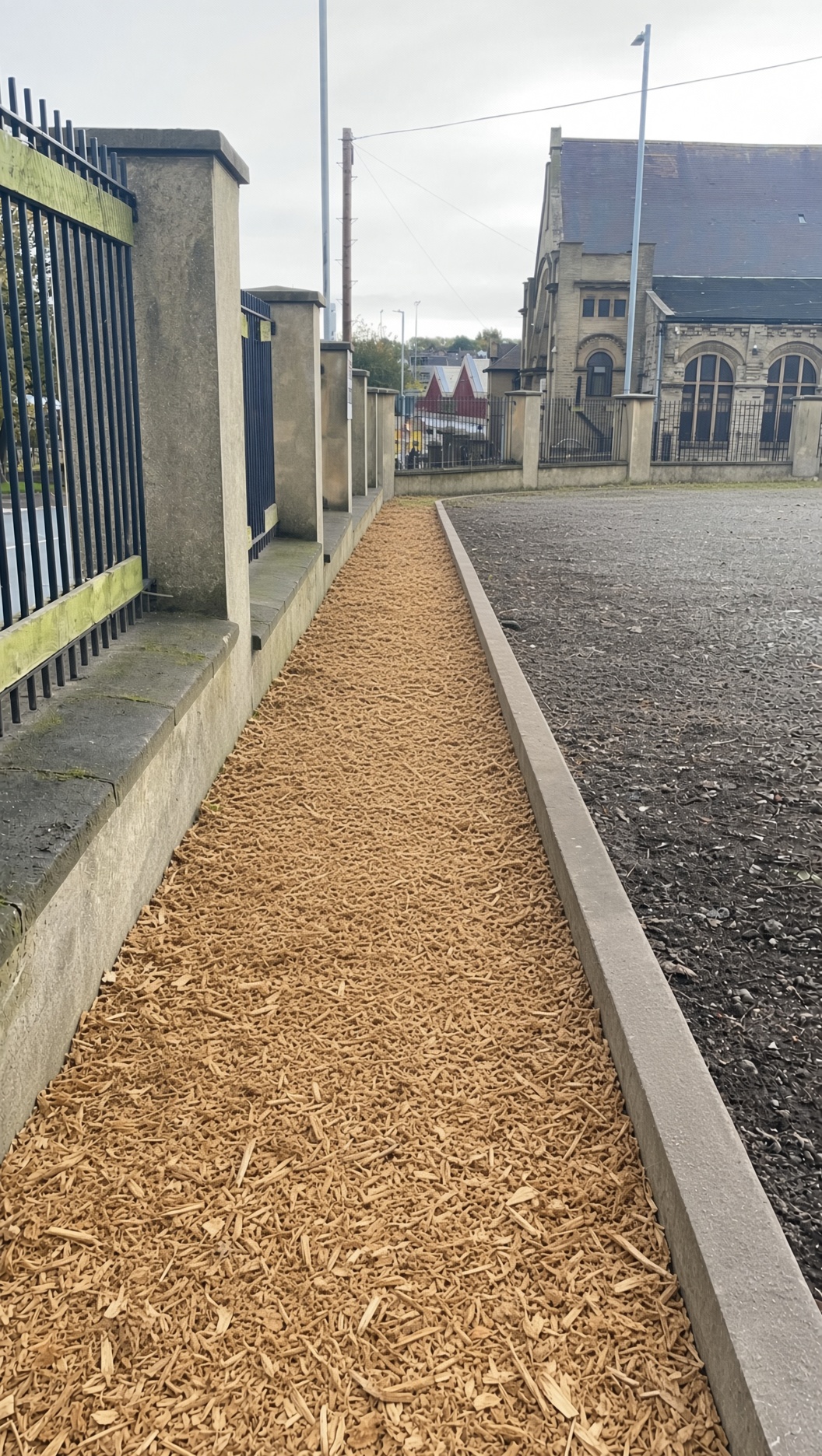 After: the same pathway cleared, edged and finished with fresh bark mulch